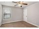 Bedroom featuring ceiling fan and a large window at 829 Overlook Path Ln, Lawrenceville, GA 30045