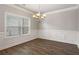 Dining room with a window, molding and dark wood floors at 829 Overlook Path Ln, Lawrenceville, GA 30045