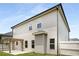 Side exterior of a two story home with a fenced in backyard and backyard wooden pergola at 829 Overlook Path Ln, Lawrenceville, GA 30045