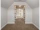 Hallway with neutral paint, carpeting, and doorways leading to other rooms in the home at 829 Overlook Path Ln, Lawrenceville, GA 30045