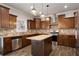 Gourmet kitchen featuring stainless steel appliances, a center island and pendant lighting at 829 Overlook Path Ln, Lawrenceville, GA 30045