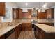 Kitchen with stainless appliances, an island, stone backsplash, and pendant lighting at 829 Overlook Path Ln, Lawrenceville, GA 30045