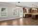 Kitchen view showcasing lots of natural light, an island, and stainless appliances and wood floors at 829 Overlook Path Ln, Lawrenceville, GA 30045