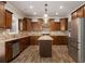 This gourmet kitchen has stainless appliances, a center island and stone backsplash at 829 Overlook Path Ln, Lawrenceville, GA 30045
