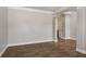Neutral living space featuring an archway and beautiful, dark wood flooring at 829 Overlook Path Ln, Lawrenceville, GA 30045