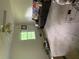 A bright living room featuring a ceiling fan and large window, with a neutral color palette at 2505 King Louis Rd, Conyers, GA 30012