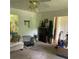 Spacious living room with neutral walls, a ceiling fan, and ample space for comfortable seating arrangements at 2505 King Louis Rd, Conyers, GA 30012
