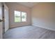 Bright bedroom features wood floors, neutral walls, and a large window with verdant outdoor views at 275 Green Commons Dr, Covington, GA 30016