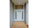 A welcoming entrance with a white front door framed by sidelights at 275 Green Commons Dr, Covington, GA 30016
