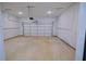 Spacious two-car garage with ample room for vehicles and storage at 275 Green Commons Dr, Covington, GA 30016