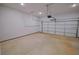 Clean, spacious two-car garage with finished concrete floor at 275 Green Commons Dr, Covington, GA 30016