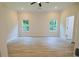 Spacious main bedroom featuring luxury vinyl plank flooring and natural light at 275 Green Commons Dr, Covington, GA 30016