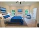 Tranquil main bedroom featuring a blue bedspread and ensuite bathroom at 275 Green Commons Dr, Covington, GA 30016