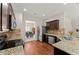 Well-lit kitchen featuring granite countertops, stainless steel appliances, and hardwood floors with eat in kitchen at 403 Sonja Ln, Loganville, GA 30052