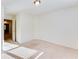 Bedroom featuring carpet flooring and a doorway leading to an open area at 992 Belfry Ter, Fairburn, GA 30213