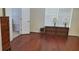Bedroom featuring a wood floor, bright natural light, and minimalist decor at 999 Simonton Glen Dr, Lawrenceville, GA 30045