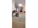 Spacious living room with a ceiling fan and various seating areas at 999 Simonton Glen Dr, Lawrenceville, GA 30045