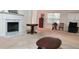 Bright and airy living room with fireplace, large windows, and comfortable seating at 999 Simonton Glen Dr, Lawrenceville, GA 30045