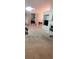 Open living room with fireplace, television, and views of the staircase at 999 Simonton Glen Dr, Lawrenceville, GA 30045