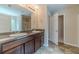 Bathroom with dual vanity, granite countertops, and a shower, providing a functional space at , Loganville, GA 30052