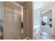 A shower with glass door, and a bathtub in the bathroom, offering a luxurious experience at , Loganville, GA 30052