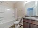 A clean bathroom with a tub-shower combination and stylish vanity at , Loganville, GA 30052