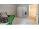 Large bedroom / office with neutral carpet leading to en-suite bath at , Loganville, GA 30052