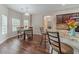 An elegant dining area with wood floors, large windows, and modern lighting at , Loganville, GA 30052