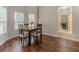 Cozy dining area with wood floors, natural light, and a view of an adjacent office at , Loganville, GA 30052