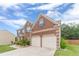 Beautiful two-story brick home featuring a two-car garage and a well-manicured lawn, and blue shutters at , Loganville, GA 30052