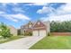 Two-story brick home with a two-car garage, and a well maintained front lawn in a nice neighborhood at , Loganville, GA 30052