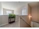 Bright hallway featuring a decorative plant and natural light from the nearby window at , Loganville, GA 30052