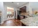 Modern kitchen featuring stainless steel appliances, granite countertops, and dark wood cabinetry at , Loganville, GA 30052