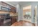 Stylish kitchen with stainless steel appliances and wood-look flooring at , Loganville, GA 30052