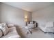 Neutral-toned living room showcasing comfortable seating and a cozy ambiance at , Loganville, GA 30052