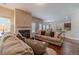 Cozy living room with a fireplace and comfortable seating, flowing into an open-concept kitchen at , Loganville, GA 30052