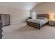 This spacious main bedroom has vaulted ceilings, a king bed, and neutral tones for a serene atmosphere at , Loganville, GA 30052