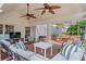 Inviting covered back porch with ample seating and ceiling fans for year-round enjoyment at 1429 Noel Ne Dr, Brookhaven, GA 30319