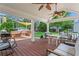 Inviting covered back porch with ample seating and backyard views at 1429 Noel Ne Dr, Brookhaven, GA 30319