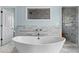 This bathroom features a soaking tub next to a tiled shower with a glass enclosure at 1429 Noel Ne Dr, Brookhaven, GA 30319