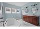 This spacious bathroom has a soaking tub, large vanity and many windows at 1429 Noel Ne Dr, Brookhaven, GA 30319