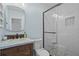 Updated bathroom with a stylish vanity, modern fixtures, and a tiled shower at 1429 Noel Ne Dr, Brookhaven, GA 30319