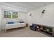 Bright bedroom with a window, daybed, and a charming reading nook at 1429 Noel Ne Dr, Brookhaven, GA 30319
