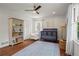 Comfortable Bedroom with hardwood floors, a crib and natural light at 1429 Noel Ne Dr, Brookhaven, GA 30319