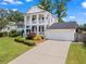 Beautiful two-story home with a well-maintained lawn, attached garage, and inviting front entrance, perfect for families at 1429 Noel Ne Dr, Brookhaven, GA 30319