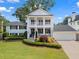 Charming two-story home with landscaped yard and inviting front porch, showcasing classic design and curb appeal at 1429 Noel Ne Dr, Brookhaven, GA 30319
