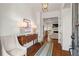 Elegant foyer featuring hardwood floors, stylish decor, and a glimpse into the living area, creating a warm welcome at 1429 Noel Ne Dr, Brookhaven, GA 30319