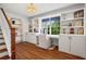 Cozy home office featuring built-in shelves, hardwood floors and bright light at 1429 Noel Ne Dr, Brookhaven, GA 30319