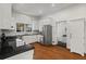 Bright kitchen with stainless steel appliances, granite countertops, and white cabinetry, offering a modern and functional cooking space at 1429 Noel Ne Dr, Brookhaven, GA 30319