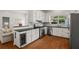 Open kitchen featuring stainless steel appliances, white cabinetry, and seamless connection to living space, perfect for modern living at 1429 Noel Ne Dr, Brookhaven, GA 30319